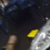 A blurry picture of someone 's feet and yellow object.