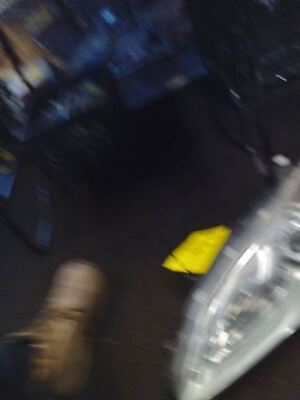 A blurry picture of someone 's feet and yellow object.
