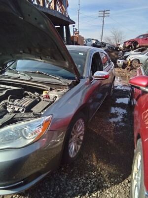A car that has been broken down and is in the water.