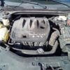 A car engine with the hood open.