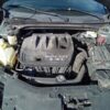 A car engine with the hood open.