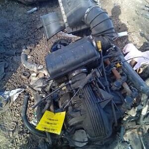 A motor engine sitting on top of some rocks.