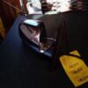 A black table with some yellow tags on it