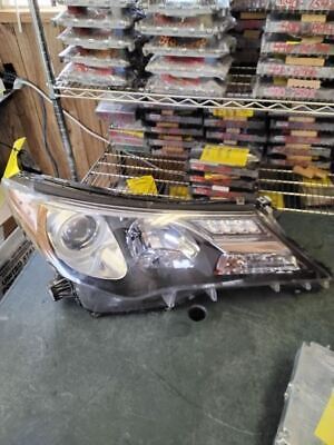 A car headlight sitting on top of a table.