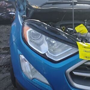 A blue car with a yellow tag on it's hood.