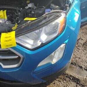 A blue car with a yellow tag on it's hood.