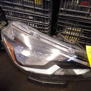 A car headlight sitting on top of a table.