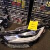 A car headlight sitting on top of a table.