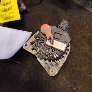 A car alternator with some other parts on it