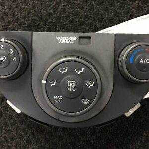 A car air conditioner control unit on the floor.