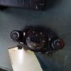 A car radio with two buttons and a remote control.