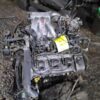 A car engine that is sitting on the ground.