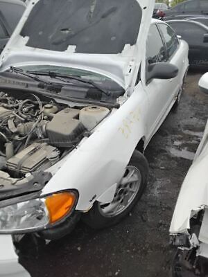 A white car that has been smashed in the back of it.