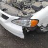 A car that has been smashed in to pieces.
