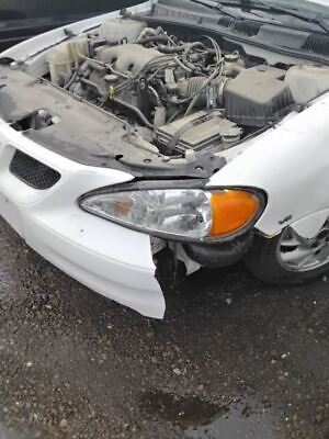 A car that has been smashed in to pieces.
