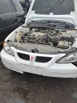 A white car with the hood up and engine exposed.