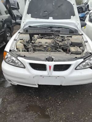 A white car with the hood up and engine exposed.