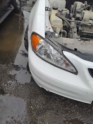A white car that has been hit by a truck.