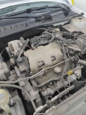 A car engine with many wires attached to it.