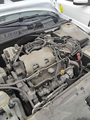 A car engine with many wires attached to it.