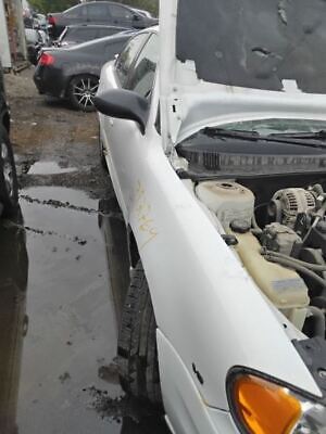 A car that has been broken down and is in the rain.