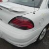 A white car with some red lights on it
