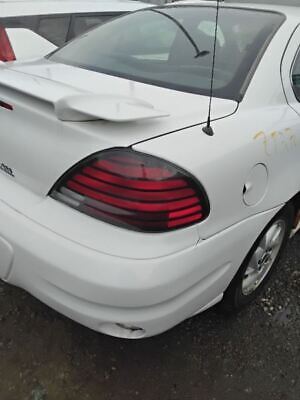 A white car with some red lights on it