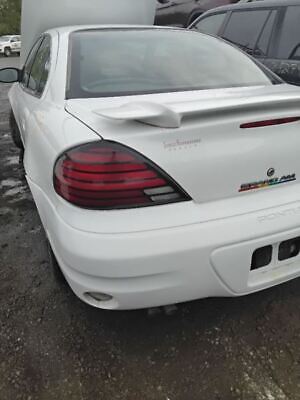A white car with the tail lights on.