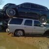 A car that is sitting on top of another car.