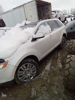 A white car with snow on the hood and side of it.
