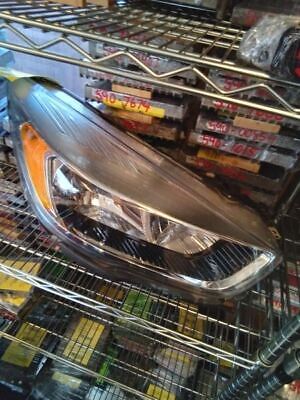 A car headlight in the middle of a rack.