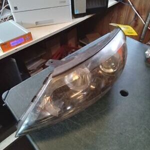 A car headlight sitting on top of a table.