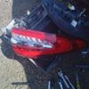 A red motorcycle is sitting on the ground