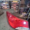 A red tail light sitting on top of a shelf.