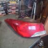 A red tail light sitting on top of a table.