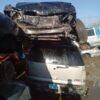 A car that has been smashed in to pieces.