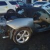 A car that has been smashed in to pieces.