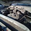A car engine with the hood open.