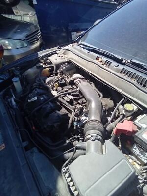 A car engine with the hood open.