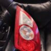A car 's rear light is on the seat of a vehicle.