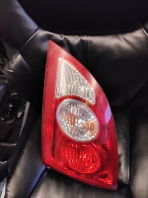 A car 's rear light is on the seat of a vehicle.