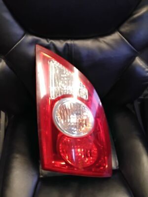 A black leather chair with a red and white light.
