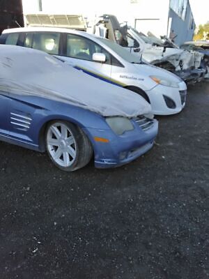 A row of cars that are in the dirt.