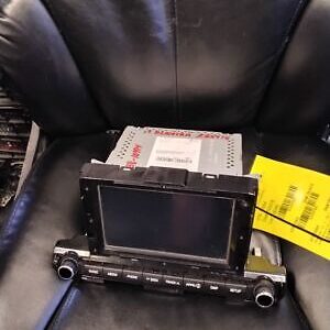 A car stereo sitting on top of a leather chair.