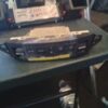 A car radio sitting on top of a table.