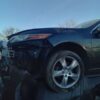 A car that has been smashed in the middle of its front end.
