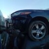 A car that has been smashed in the back of it.