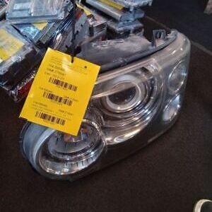 A close up of a car headlight with a price tag