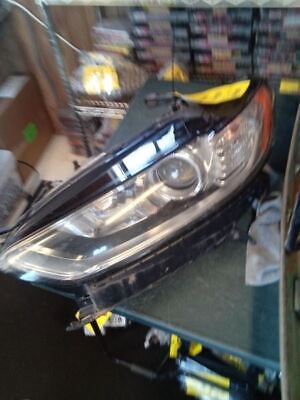 A car headlight is shown on the floor.