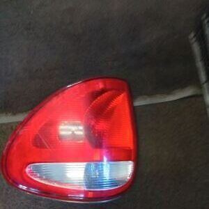 A car tail light that is on the ground.